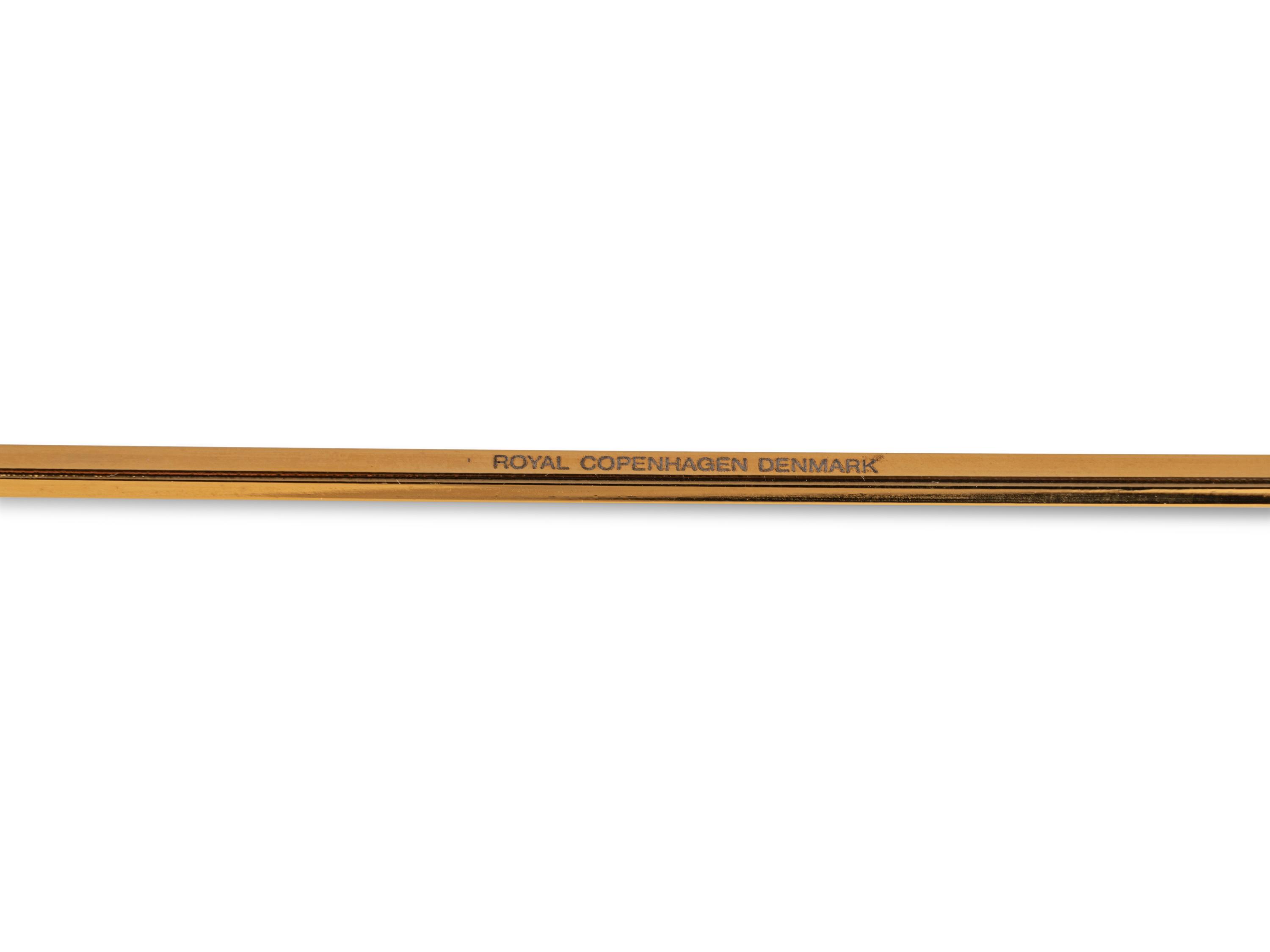 An Andreas Mikkelsen Designed Georg Jensen Gilt-Metal Candle Snuffer