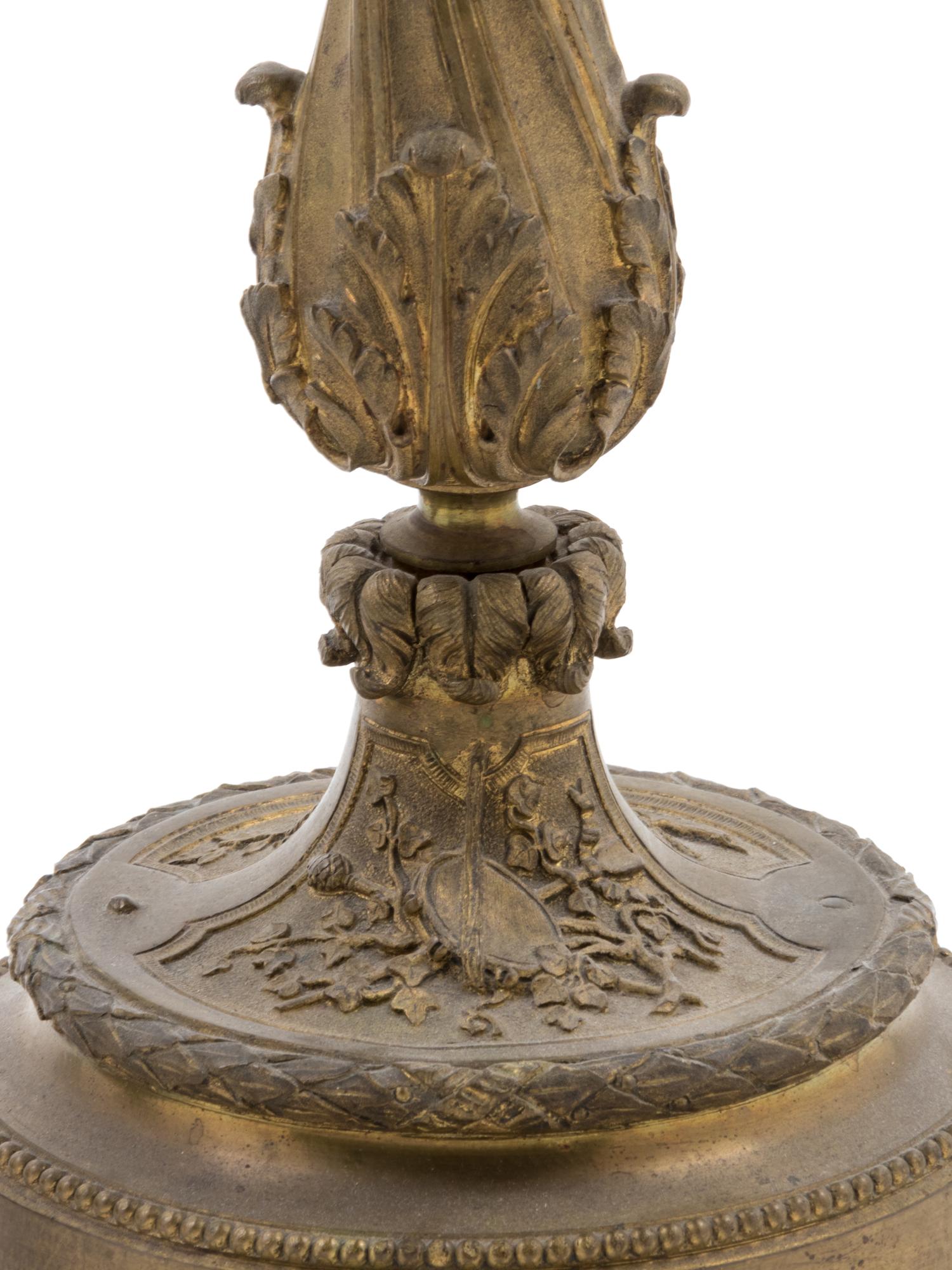 A French Gilt Bronze Candlestick and Figural Mirror