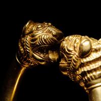 A Western Asiatic Gold Bracelet with Lion Headed Terminals