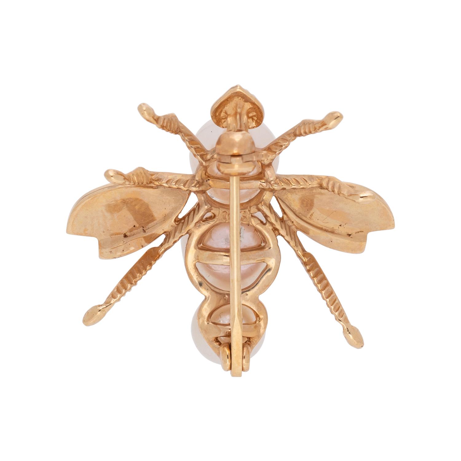COLLECTION OF YELLOW GOLD BROOCHES