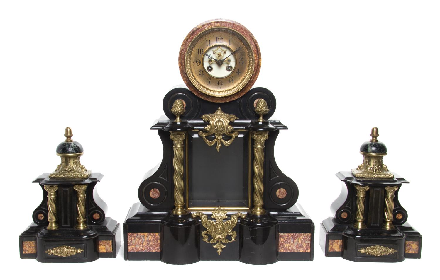 A Neoclassical Gilt Metal Mounted Marble Clock Garniture Height of clock 30 3/4 inches.