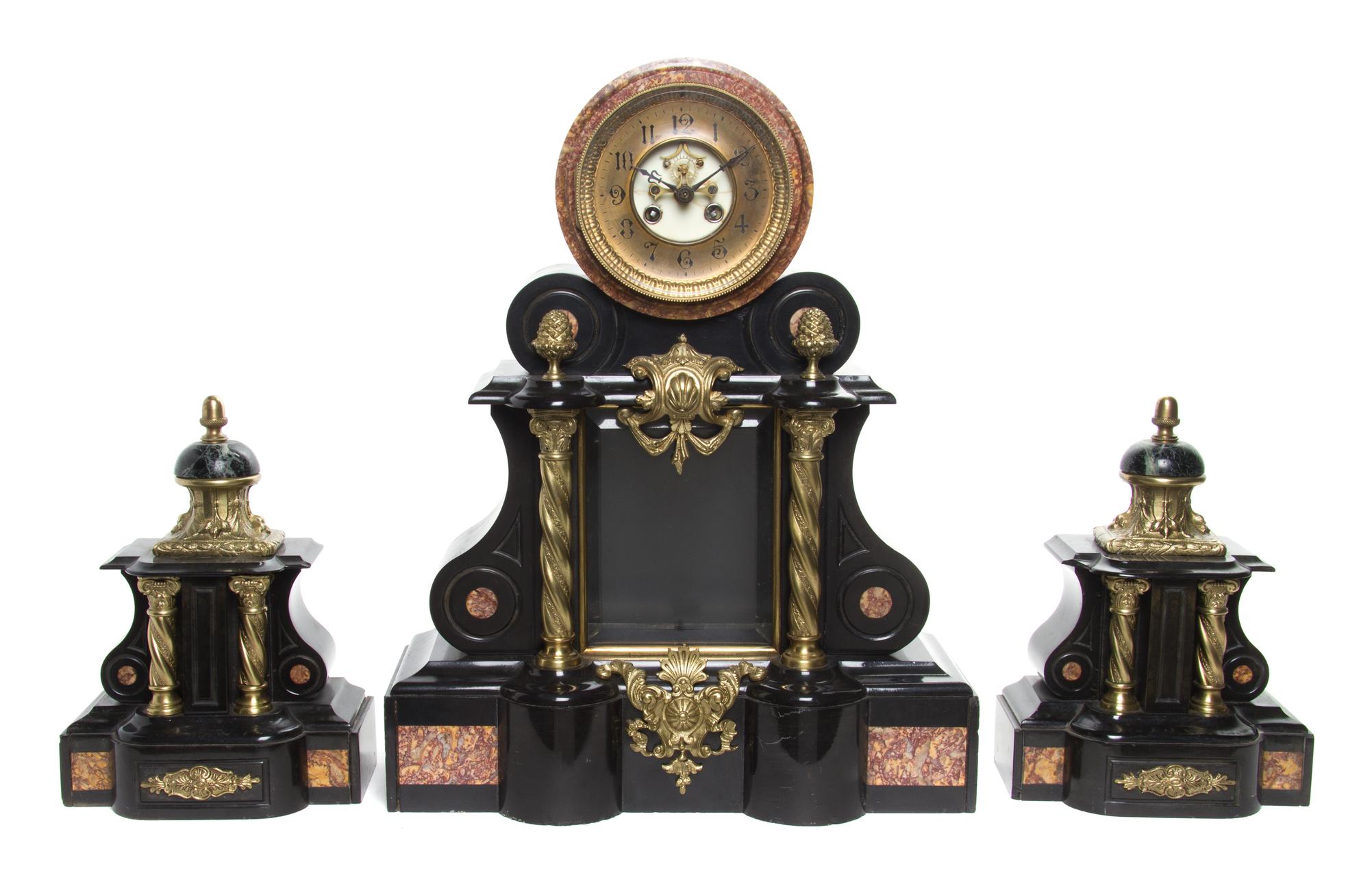 A Neoclassical Gilt Metal Mounted Marble Clock Garniture Height of clock 30 3/4 inches.