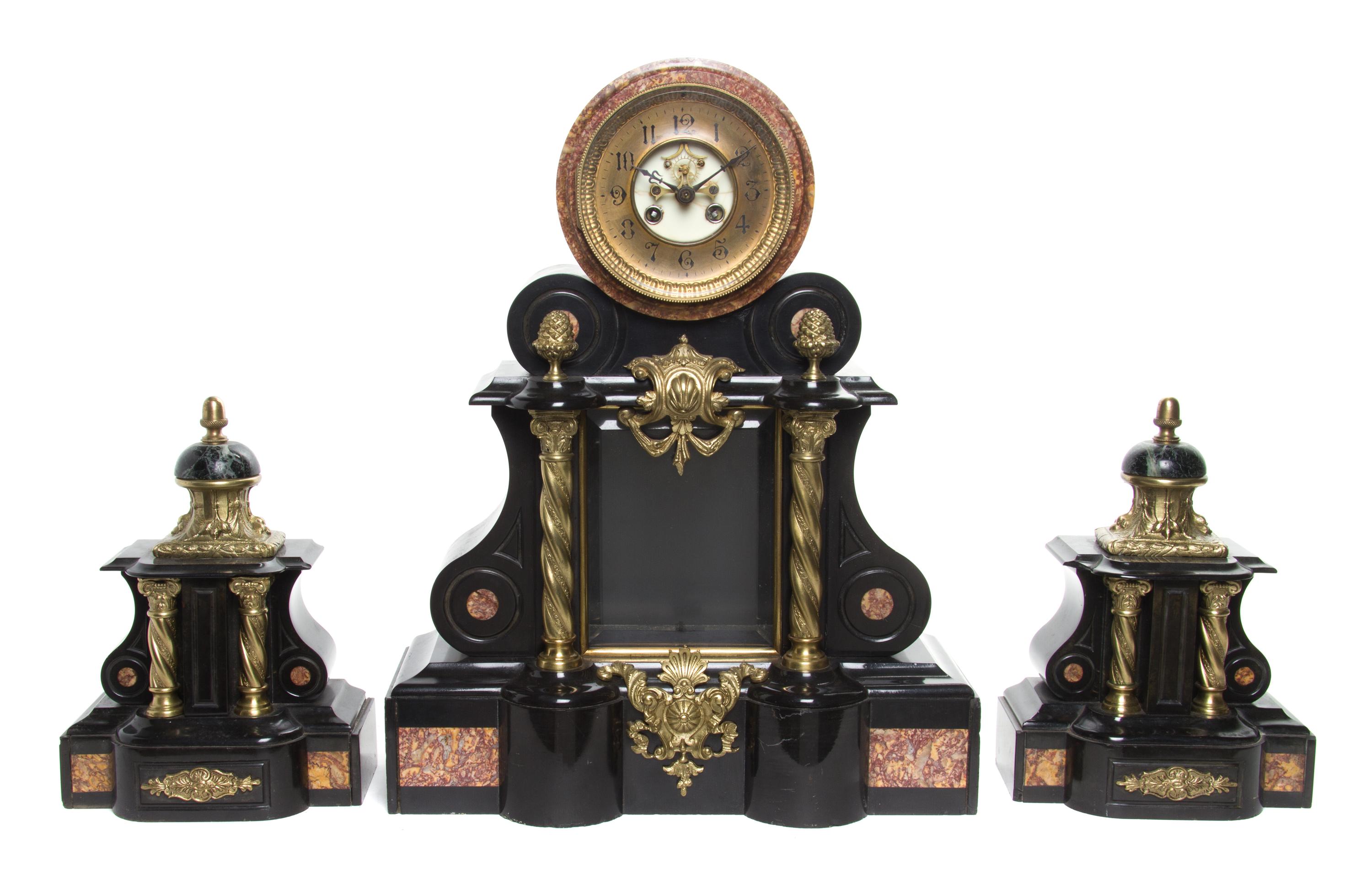 A Neoclassical Gilt Metal Mounted Marble Clock Garniture Height of clock 30 3/4 inches.