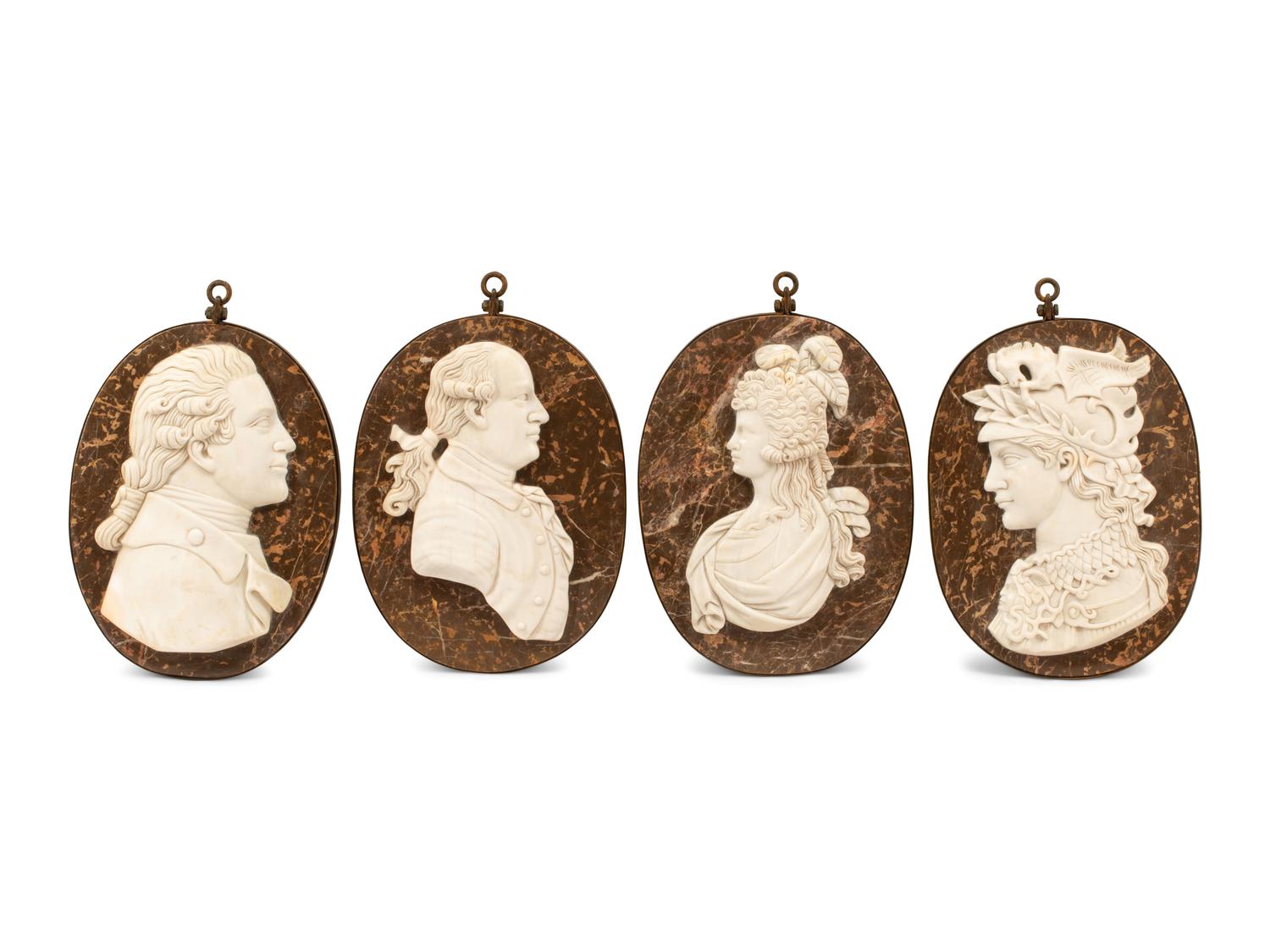 A Set of Four Iron-Framed Marble Portrait Medallions