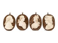 A Set of Four Iron-Framed Marble Portrait Medallions