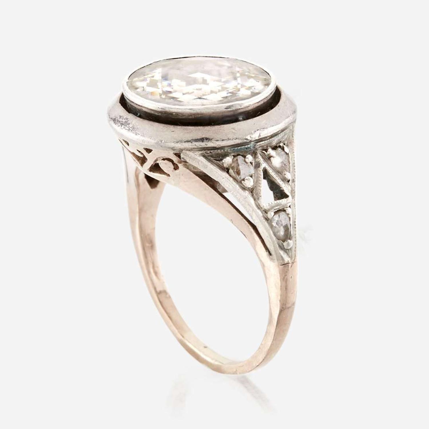 A diamond, sterling silver, and gold ring