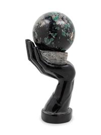 A Carved Hardstone Ornament Depicting a Globe in the Palm of a Hand