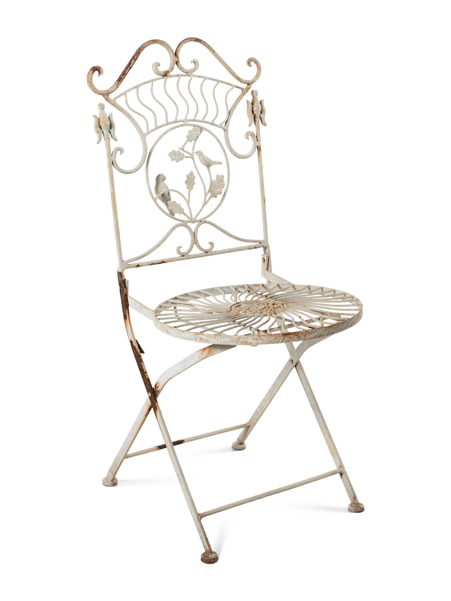 A Painted Cast Iron Garden Table and Two Chairs