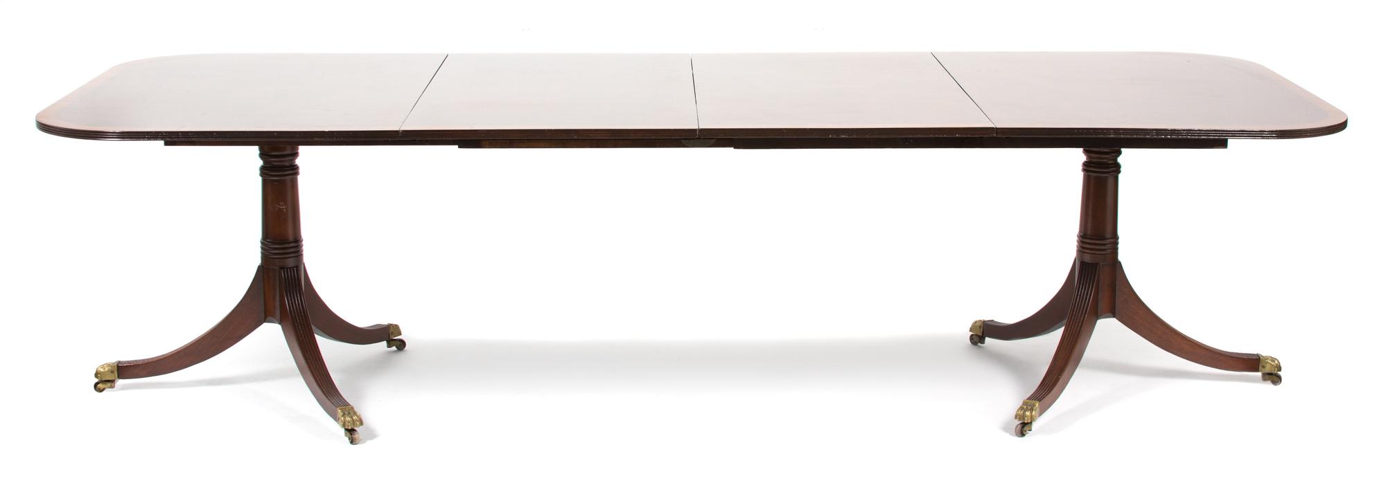 A Georgian Style Pedestal Dining Table Height 28 1/2 x width closed 62 1/2 x depth 45 inches. — 20TH CENTURY