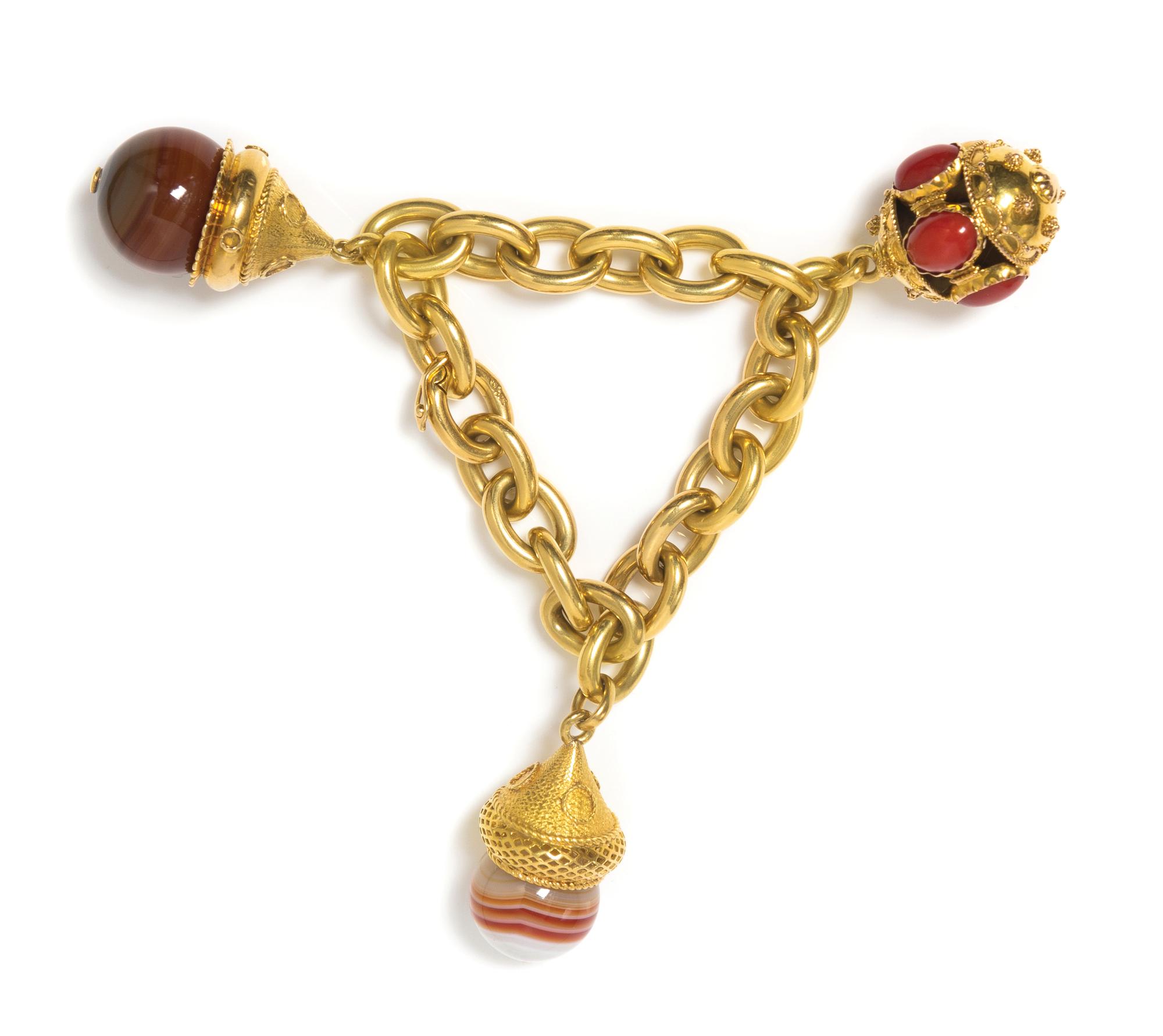 An 18 Karat Yellow Gold Charm Bracelet with Three Gold and Gem Pendant Charms, 72.00 dwts.