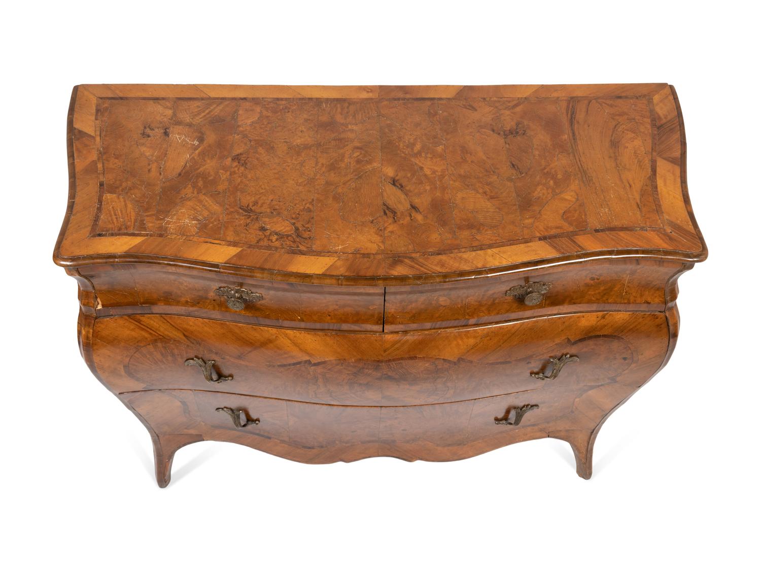 An Italian Rococo Style Walnut or Olivewood Bombe Chest of Drawers