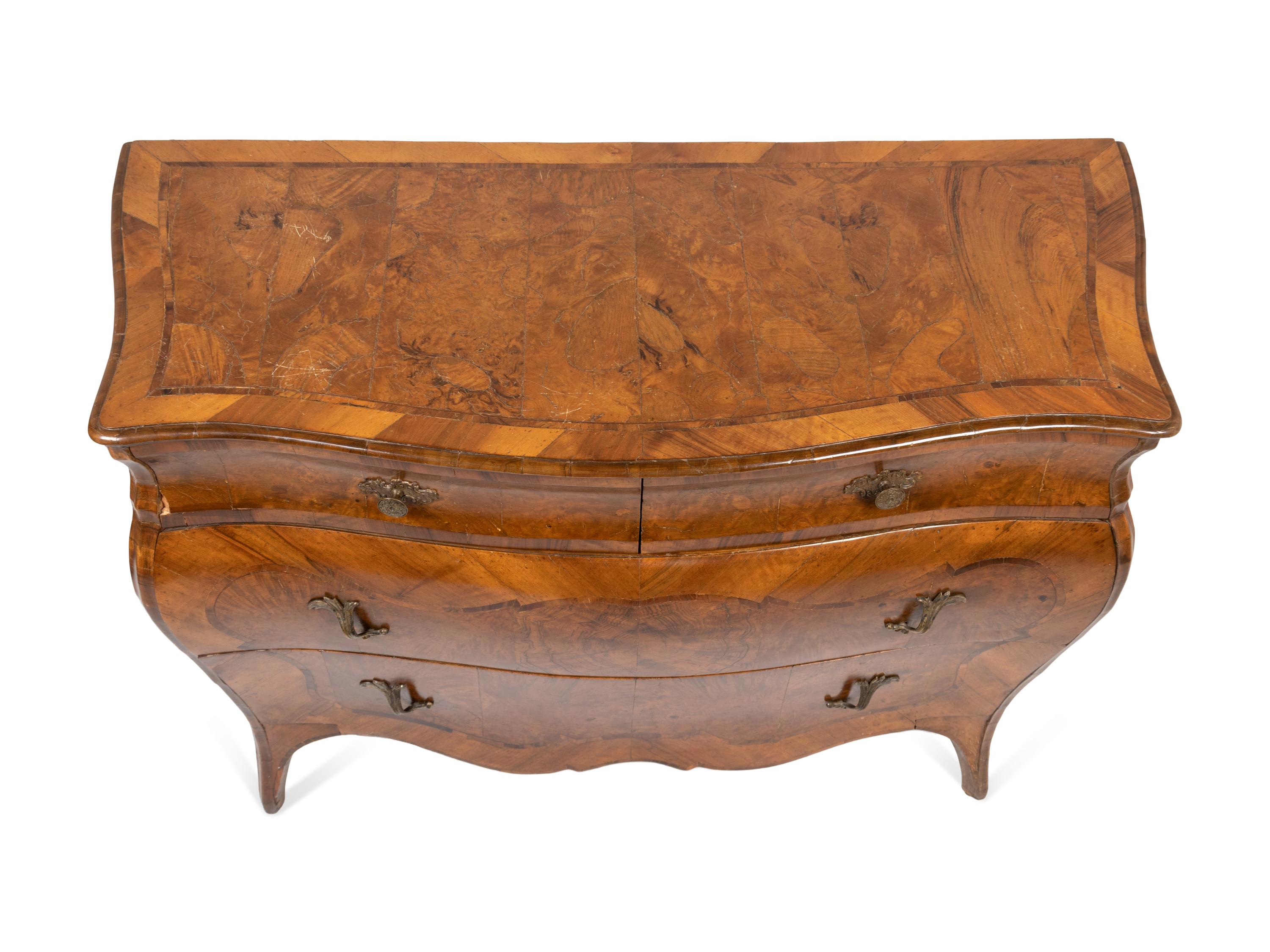 An Italian Rococo Style Walnut or Olivewood Bombe Chest of Drawers