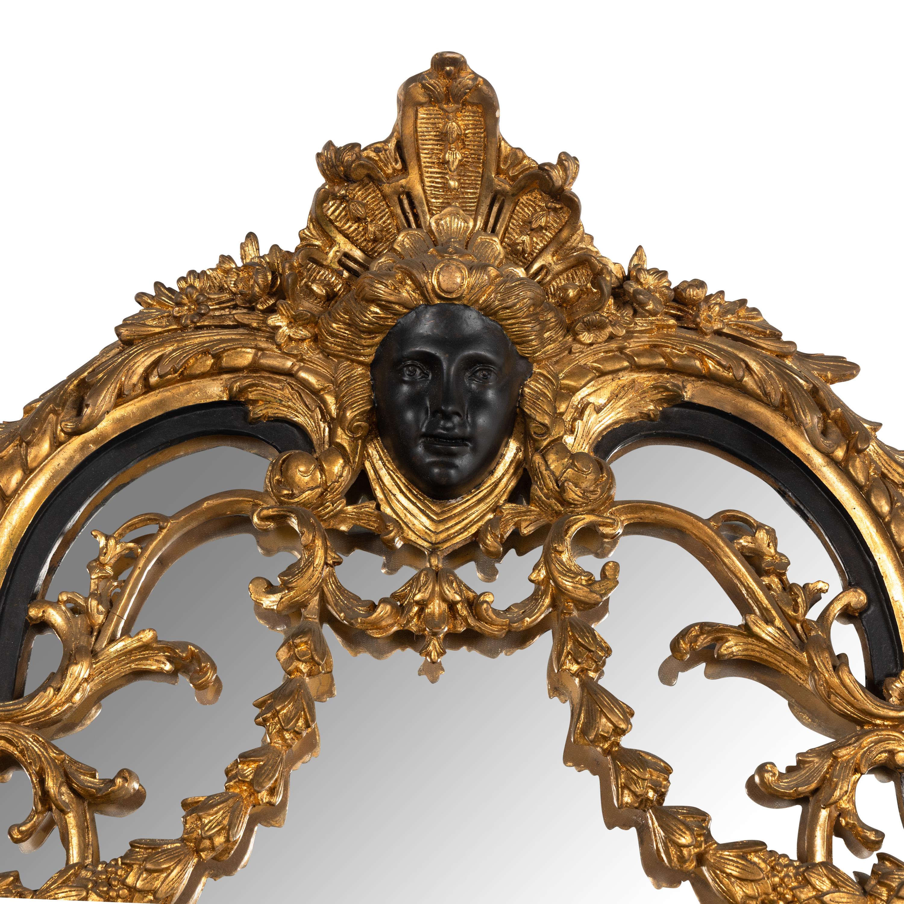 A Baroque Style Part Ebonized Giltwood and Gesso Mirror