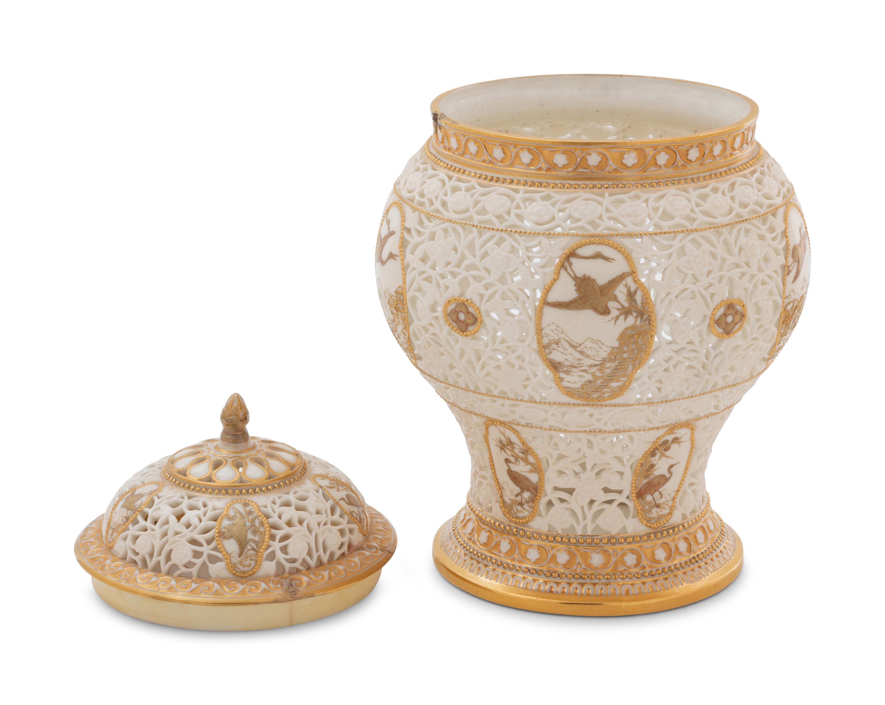 A Royal Worcester Parcel Gilt Reticulated Porcelain Vase and Cover