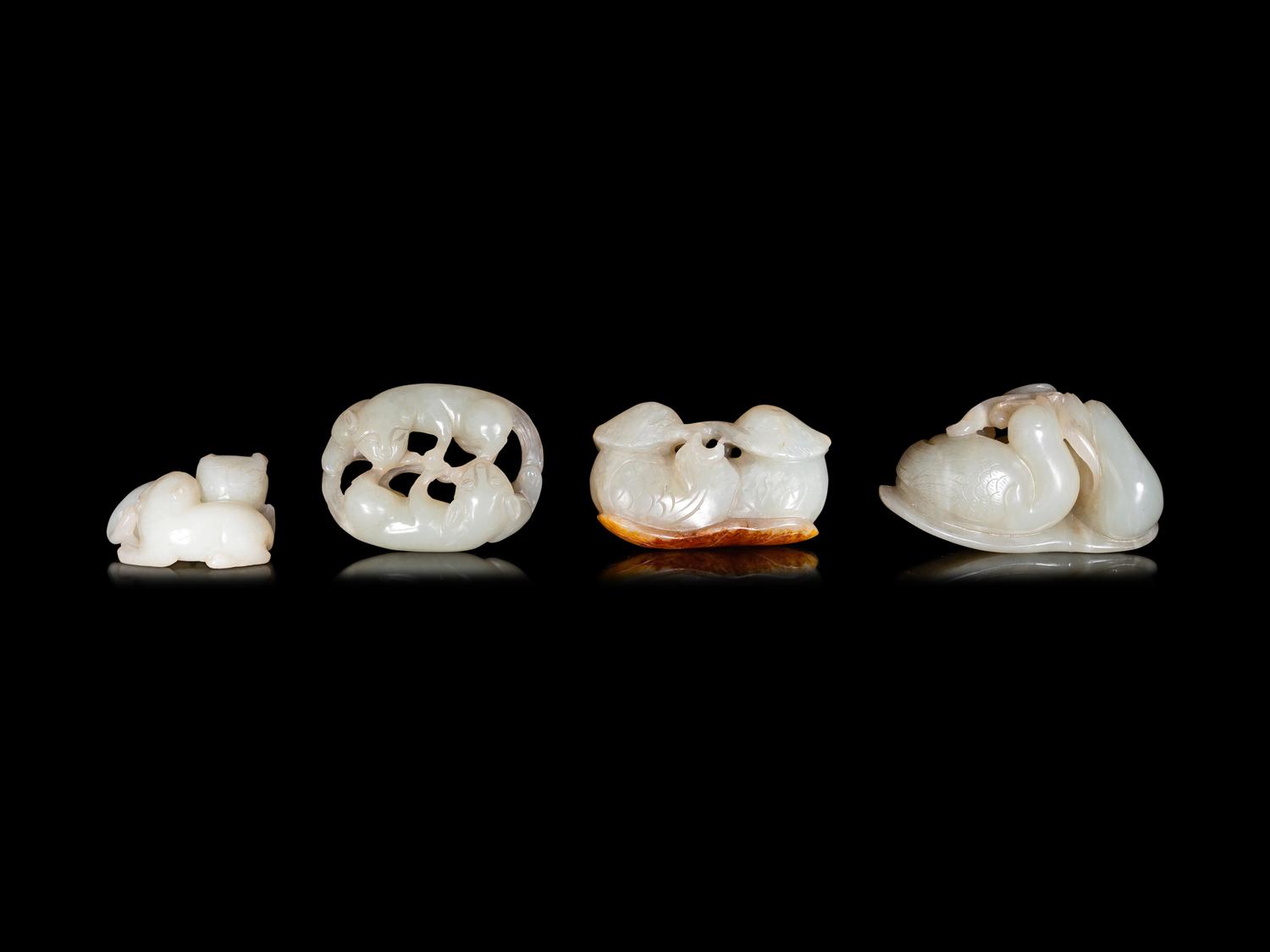 Four Chinese Carved Celadon Jade Figures
