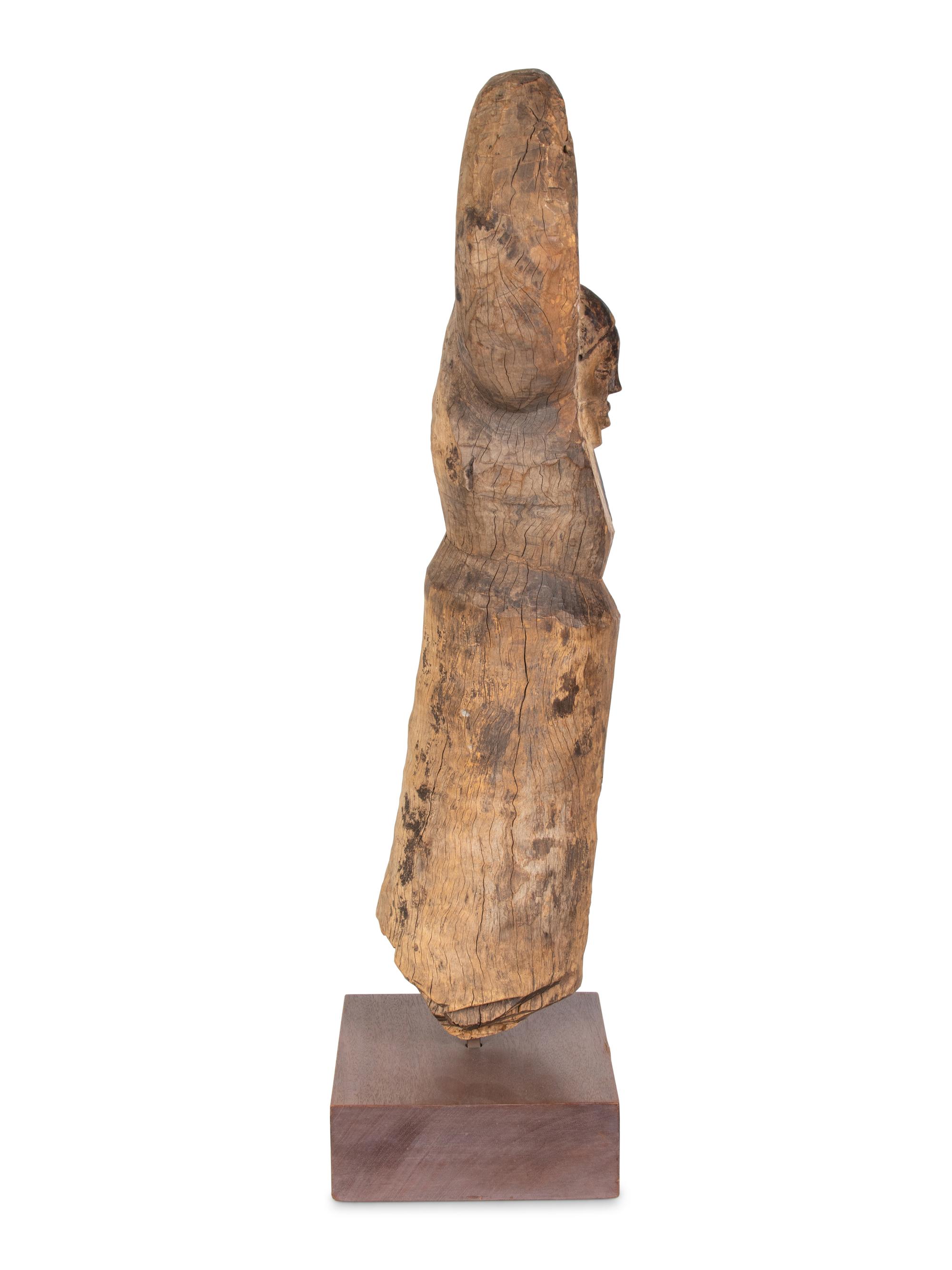 A Yaka Post, with forked finial painted blue and white, a mask in relief at the center