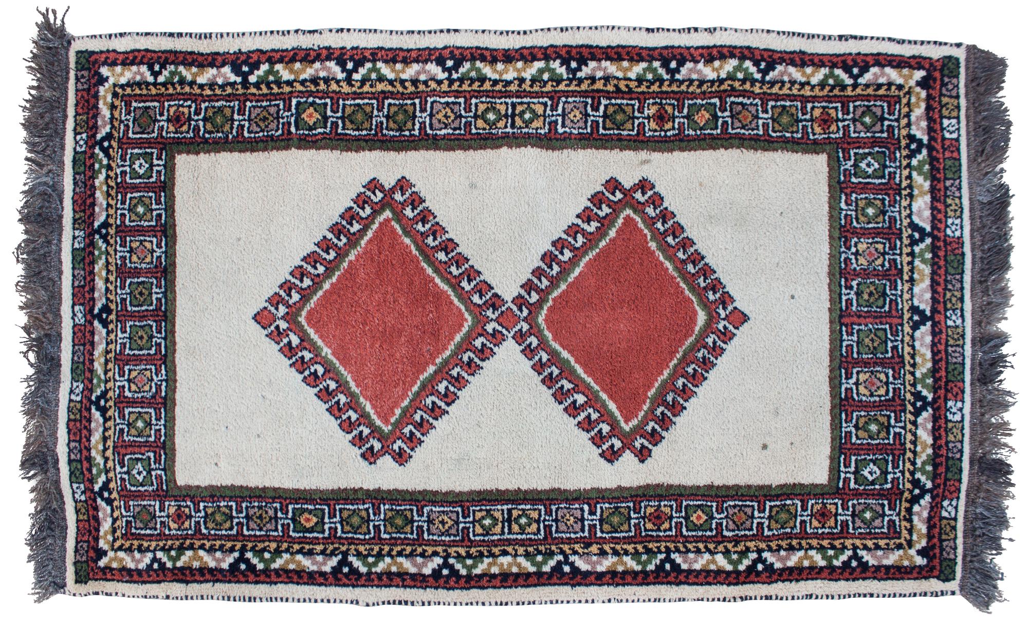 A Broadloom Wool Rug 5 feet 5 inches x 3 feet 5 inches.