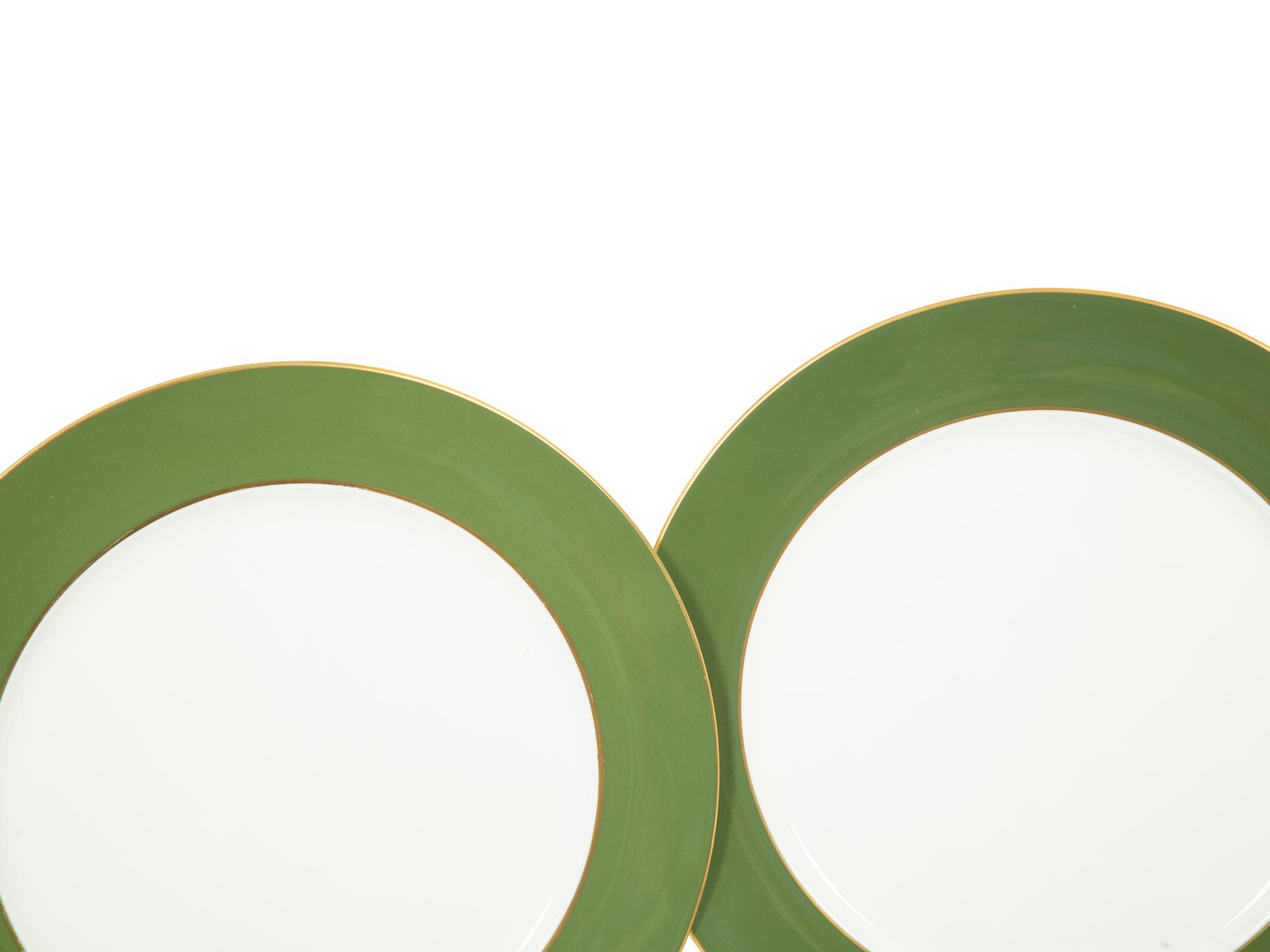 A Set of Fourteen Royal Crown Derby Green Band Chargers