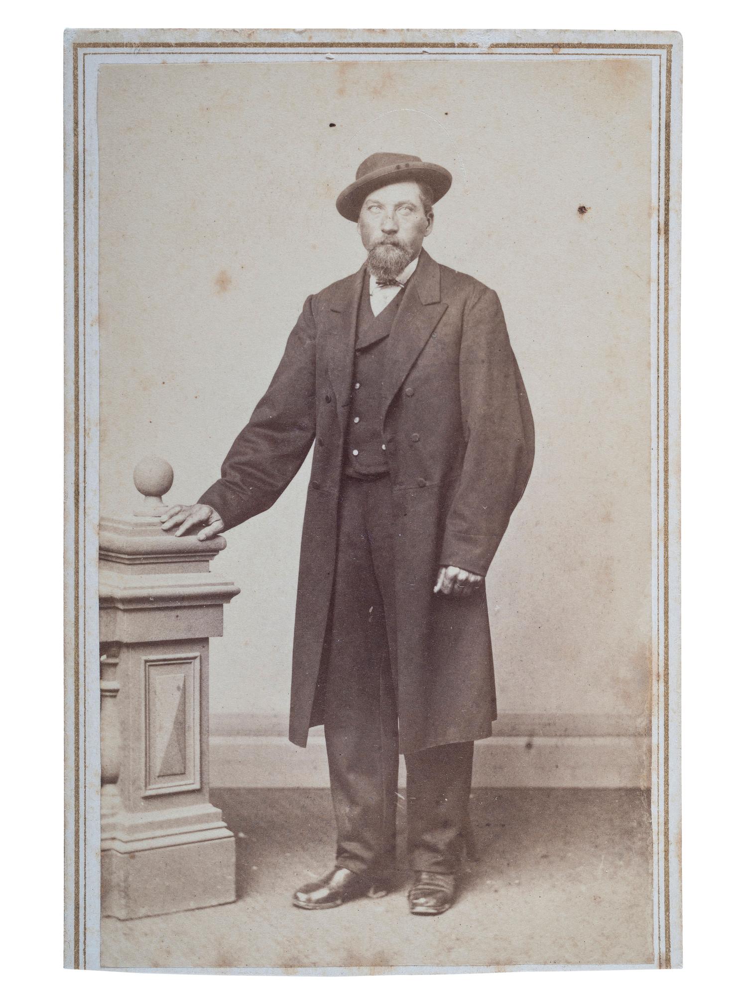 [OUTLAWS & LAWMEN]. CDV, full-length studio portrait of Cole Younger.