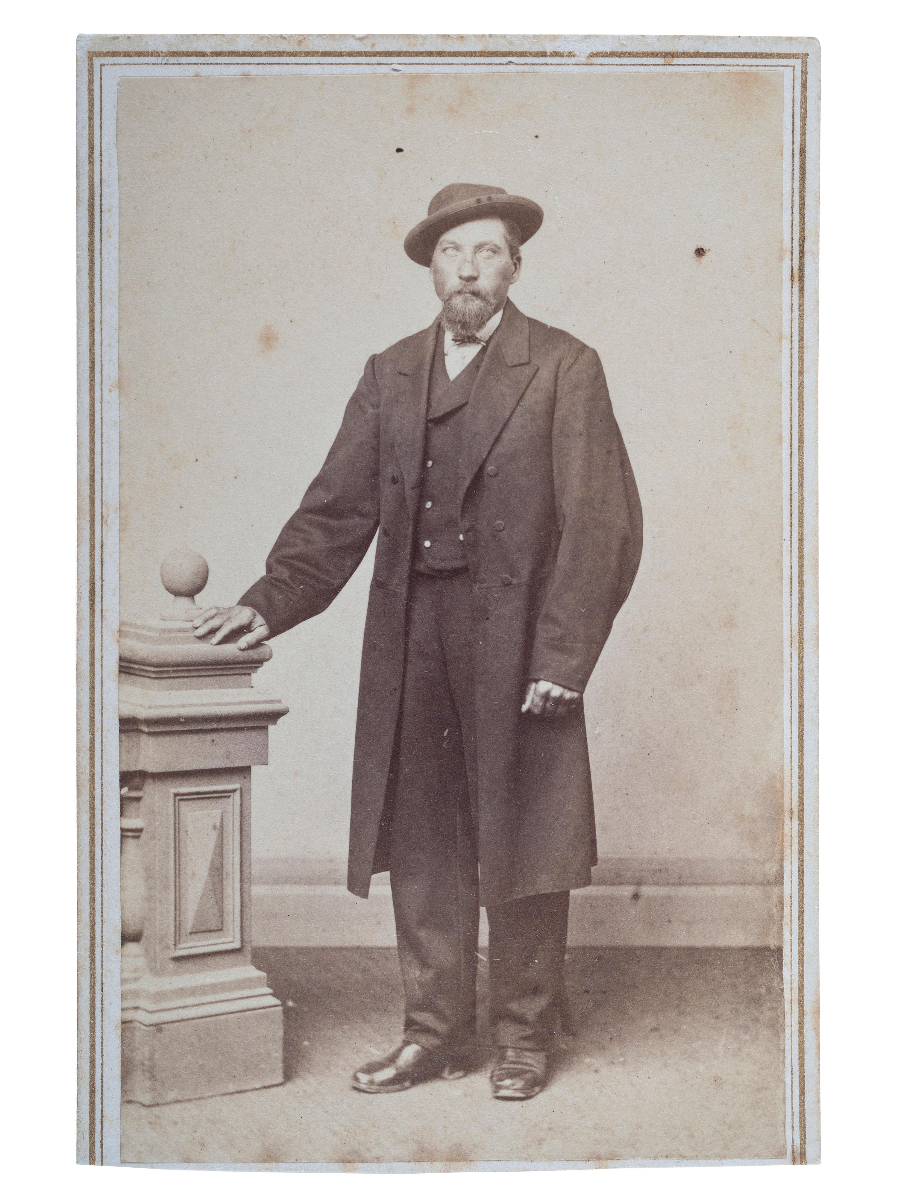 [OUTLAWS & LAWMEN]. CDV, full-length studio portrait of Cole Younger.