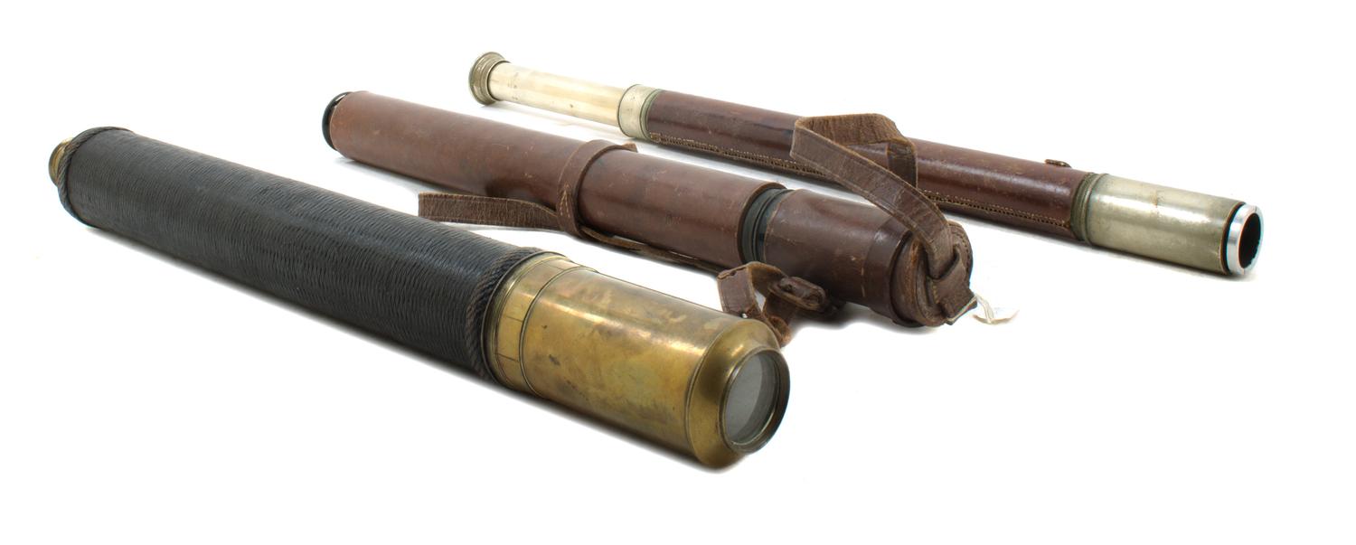 A Group of Three Leather Body Single-Draw Hand Telescopes Length of longest 19 inches (closed).