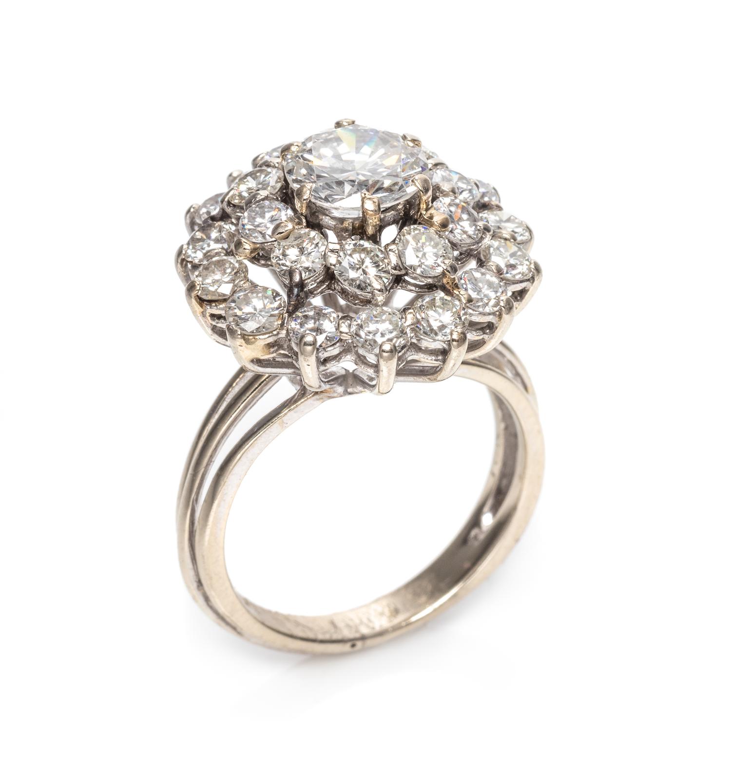An 18 Karat White Gold and Diamond Cluster Ring,