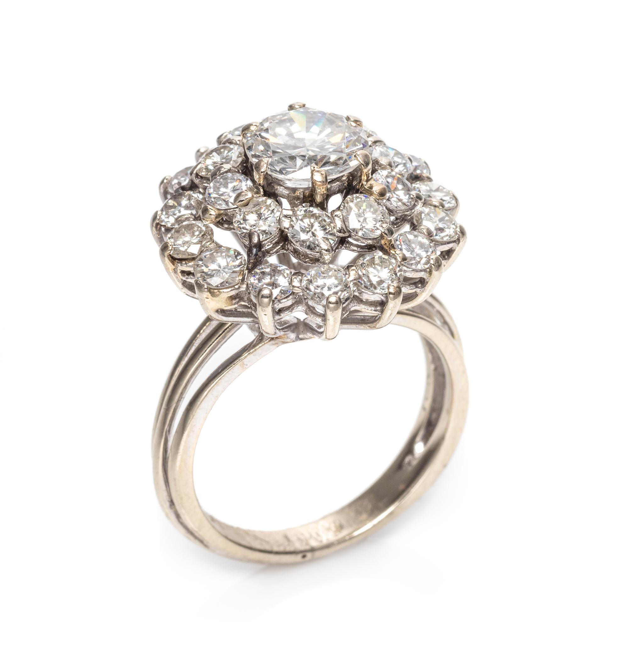 An 18 Karat White Gold and Diamond Cluster Ring,