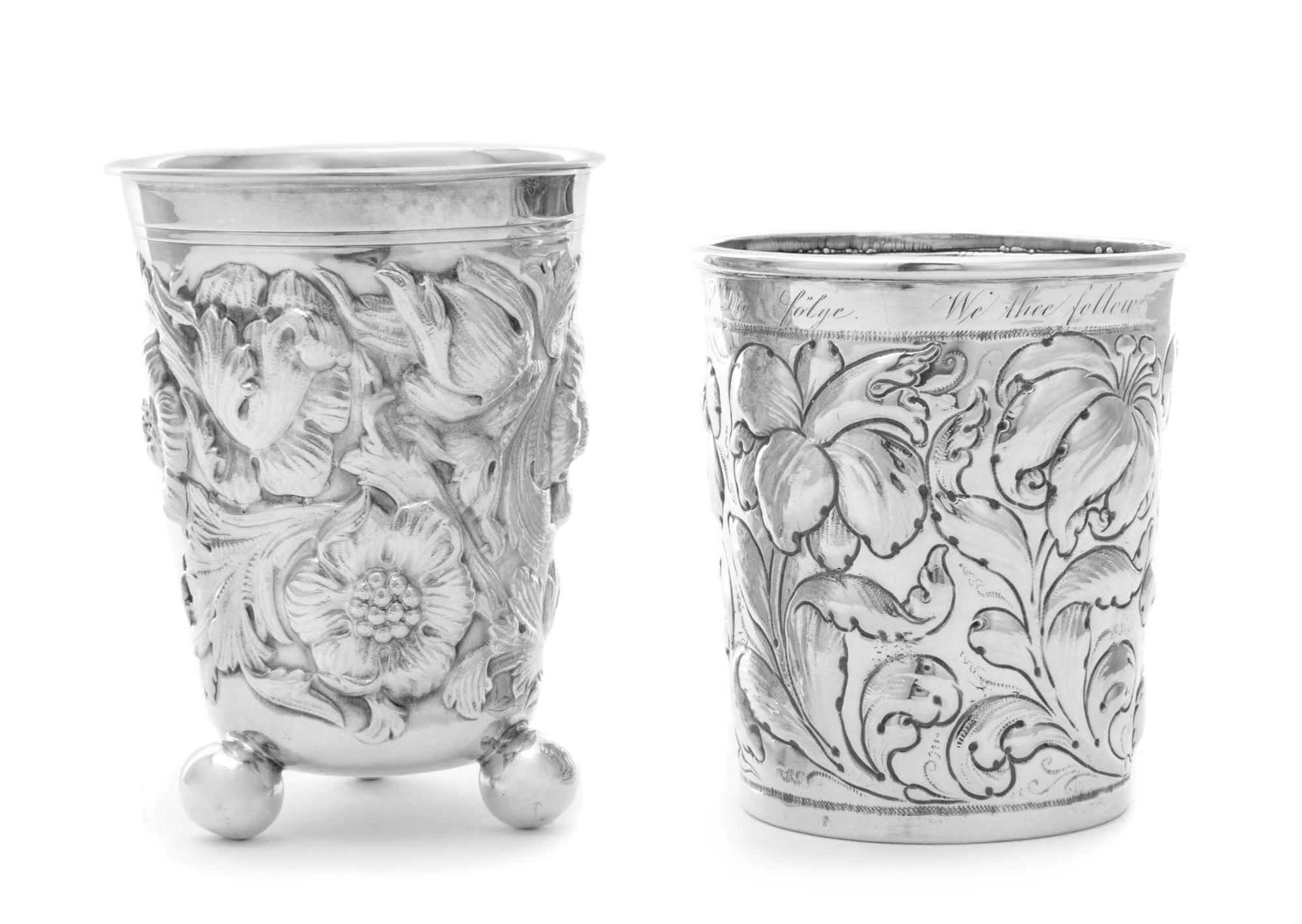 A Portuguese Silver Cup, 20th Century, of footed form with floral decoration; together with a silvered metal beaker with similar decora