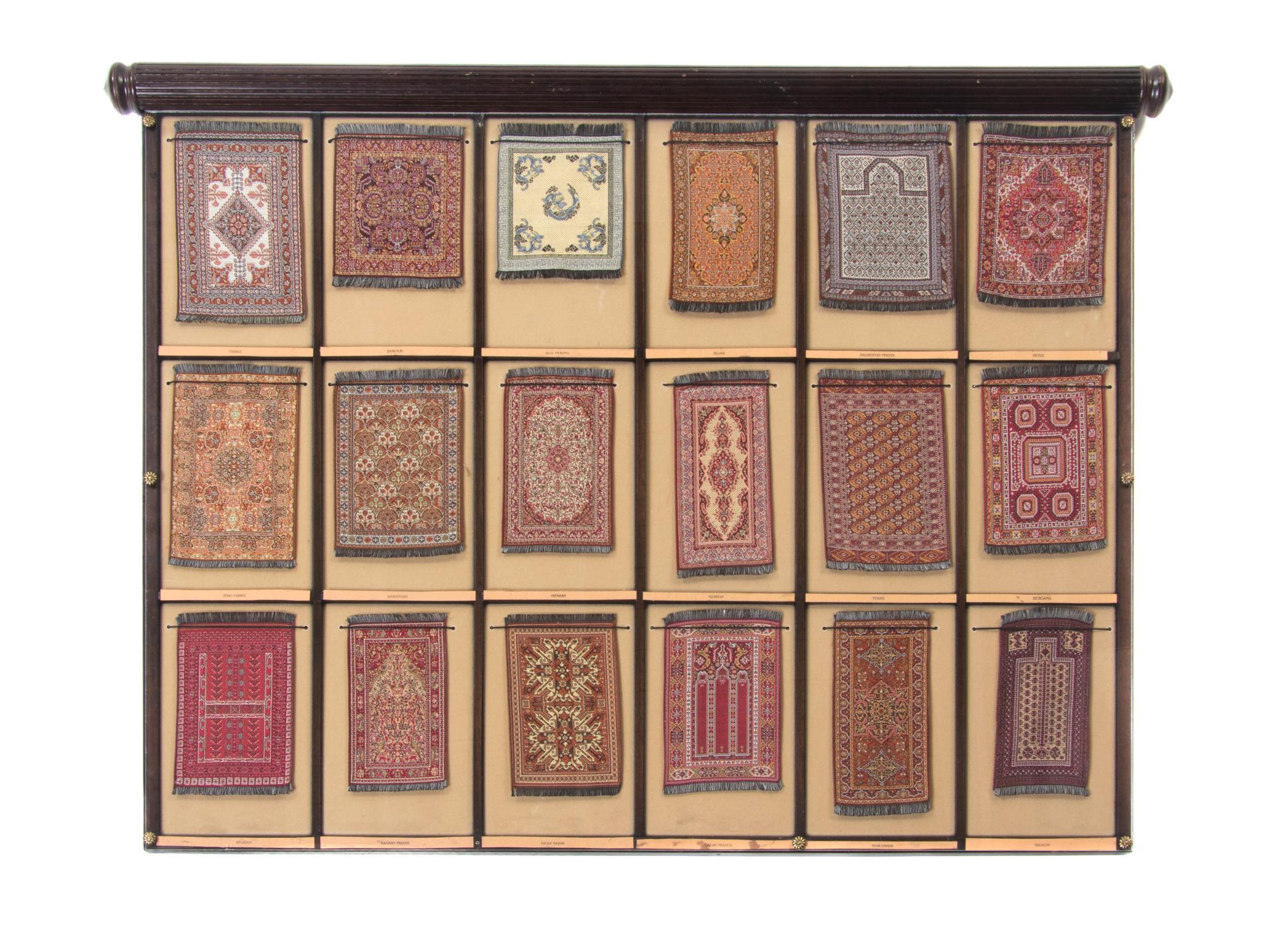 A Cased Set of Miniature Persian Rugs, Width overall 33 inches.