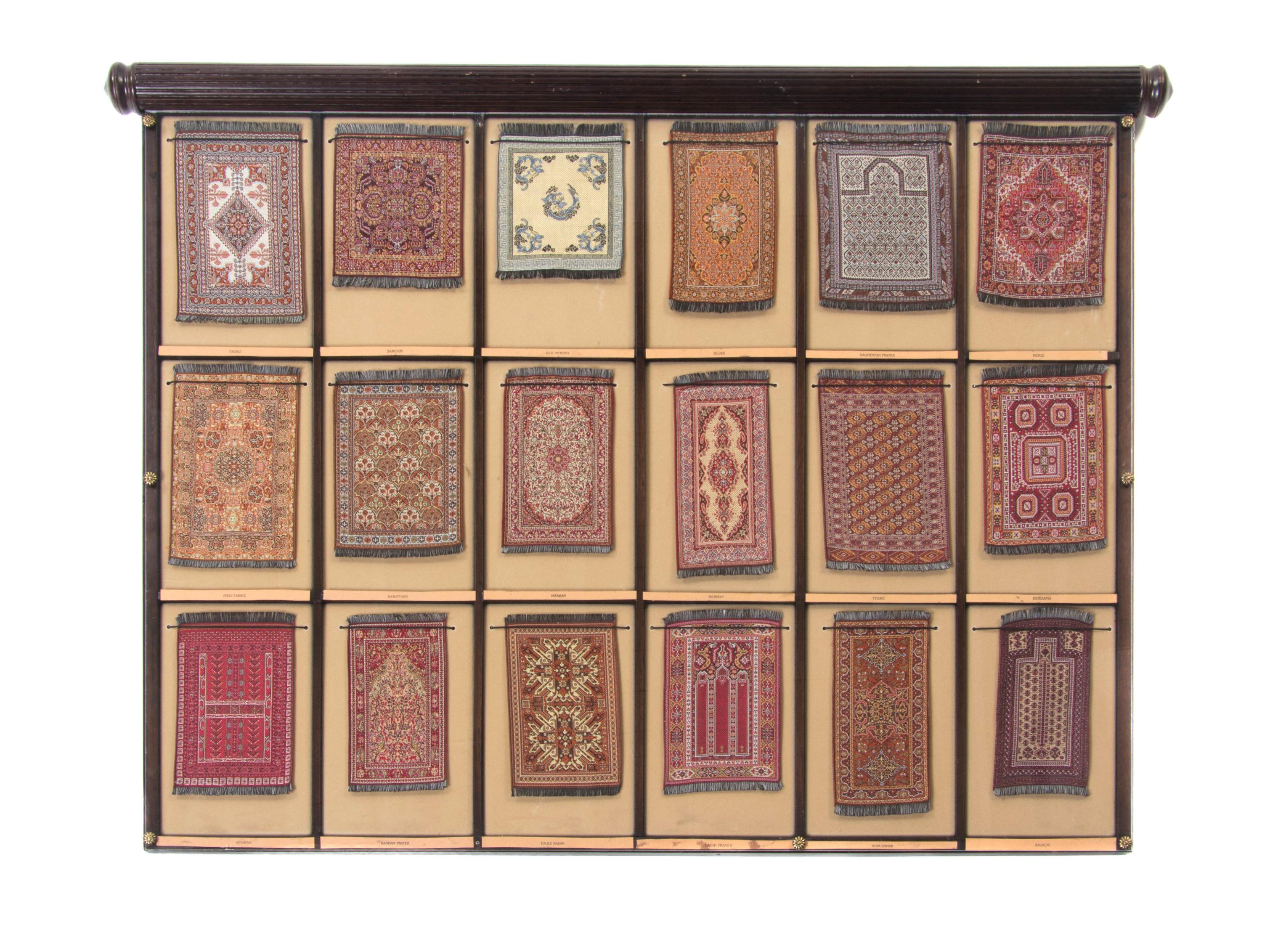 A Cased Set of Miniature Persian Rugs, Width overall 33 inches.