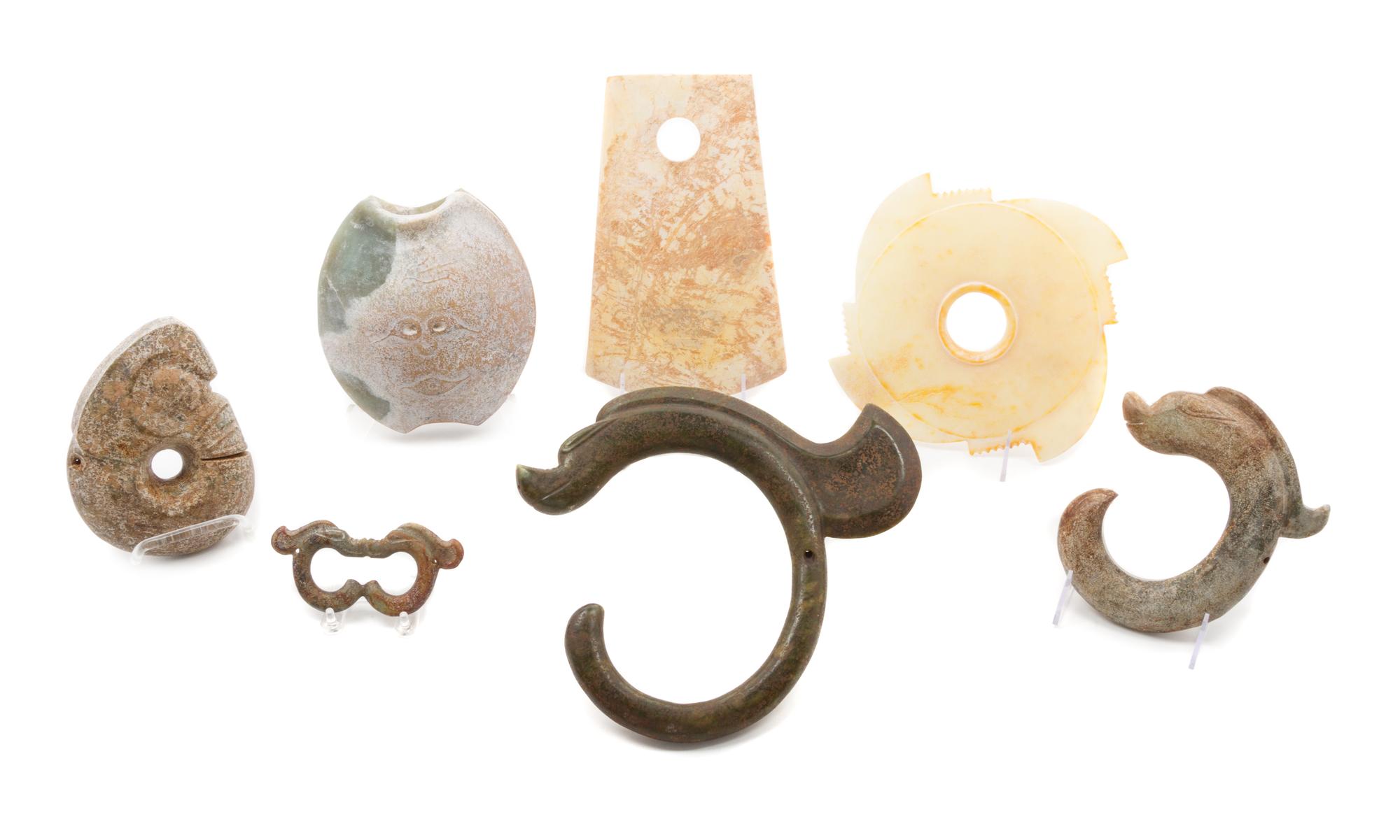 A Group of Seven Archaistic Jade Articles Length of largest 10 inches.