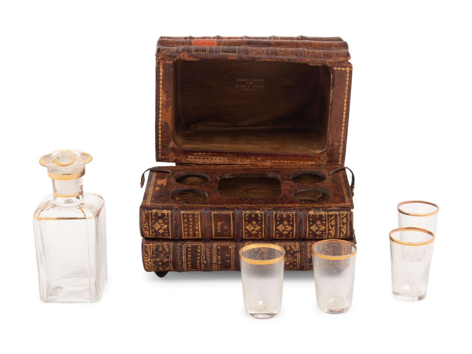 A French Musical Faux Book-Form Decanter Set