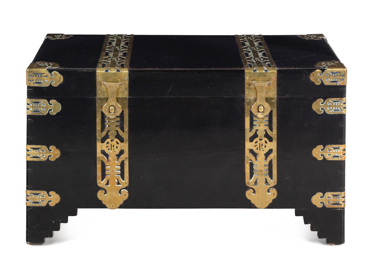 A Chinese or Korean Export Lacquer-Finished Brass Mounted Trunk