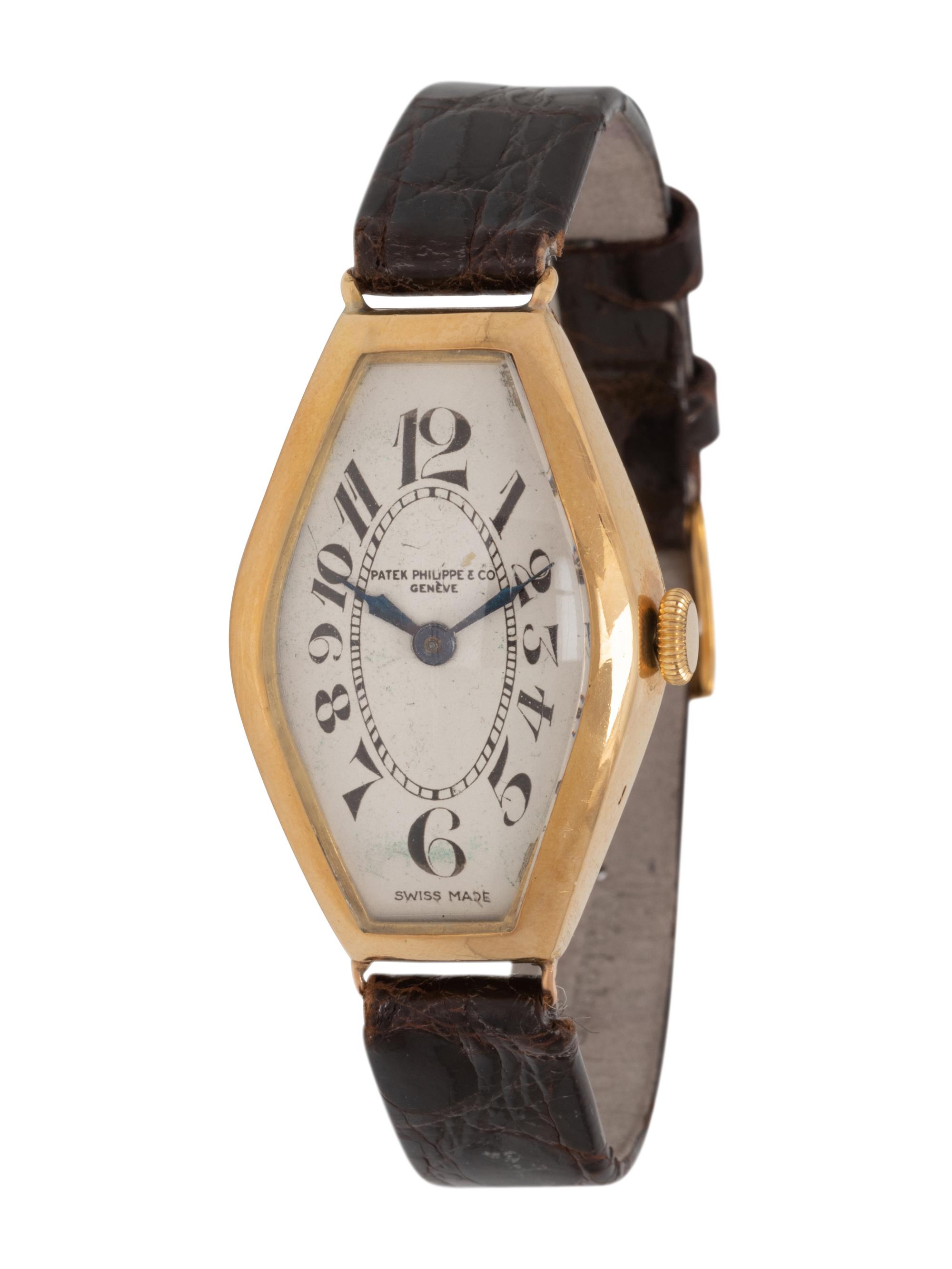 PATEK PHILIPPE, 18K YELLOW GOLD 'TONNEAU' WATCH