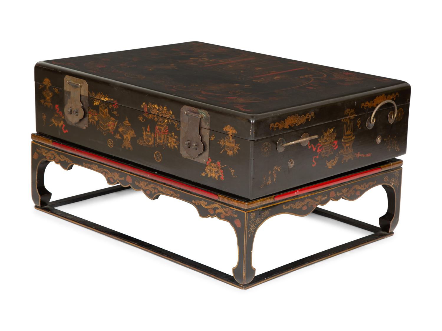 A Chinese Lacquered Trunk on Stand