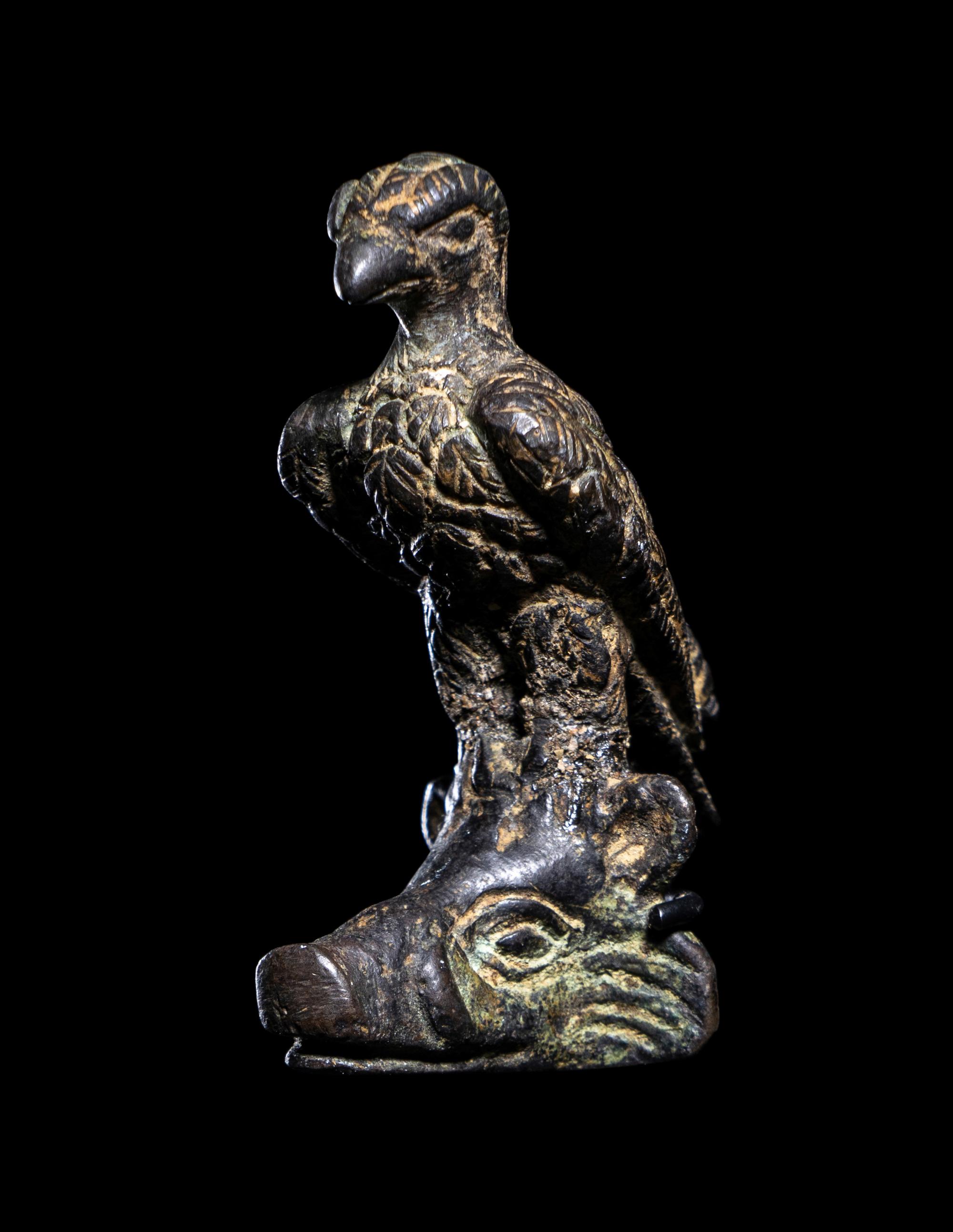 A Roman Bronze Eagle Perched on a Boar's Head