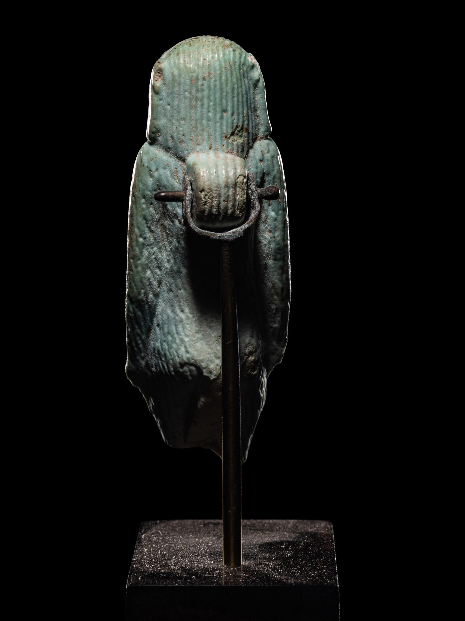 An Egyptian Faience Standing Ape