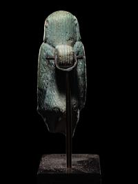 An Egyptian Faience Standing Ape