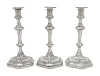 A Set of Three George III Silver Candlesticks