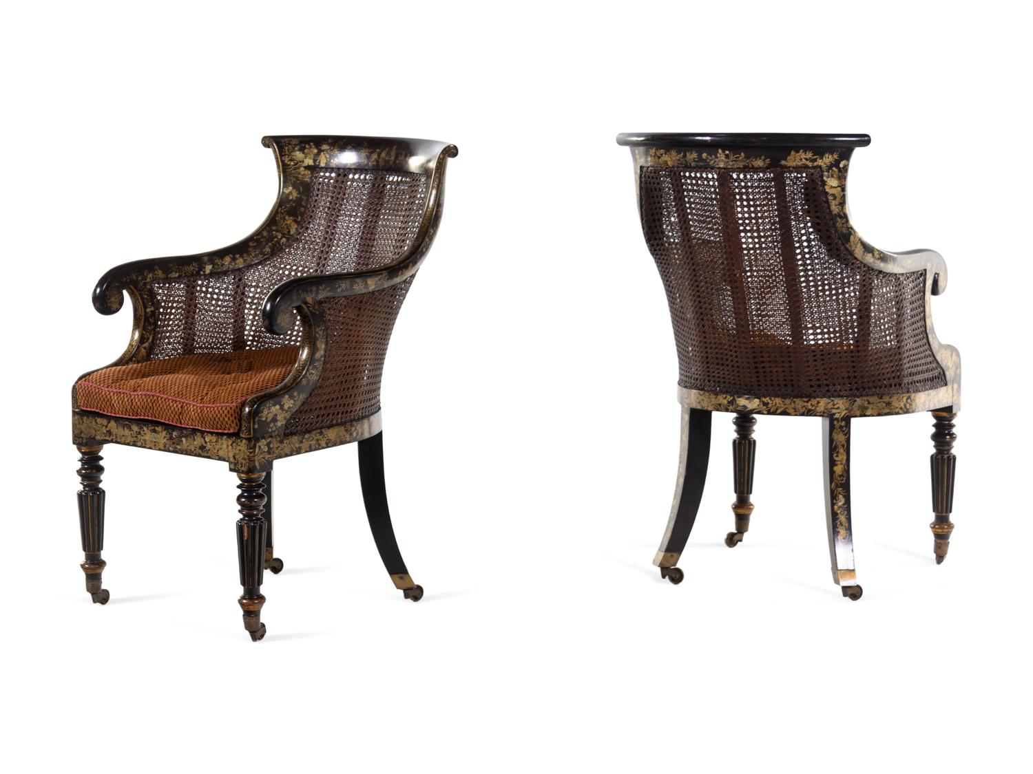 A Pair of William IV Parcel Gilt Japanned and Cane Upholstered Armchairs