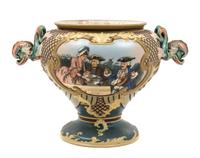 A Mettlach Stoneware Center Bowl Height 11 1/2 inches.