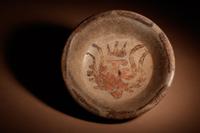 A Maya Polychrome Terracotta Tripod Plate with Tlaloc (Rain God)