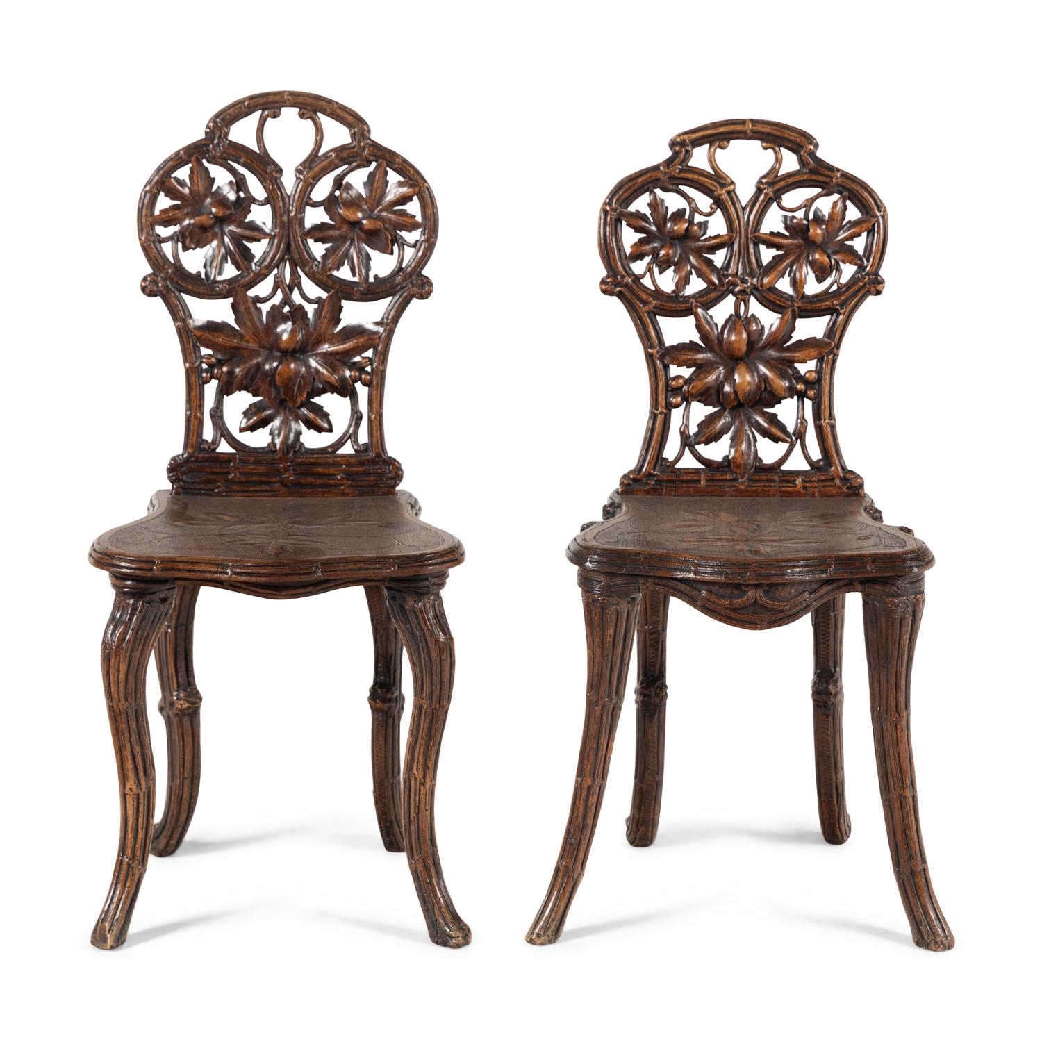 A Pair of Black Forest Oak Leaf Carved Side Chairs