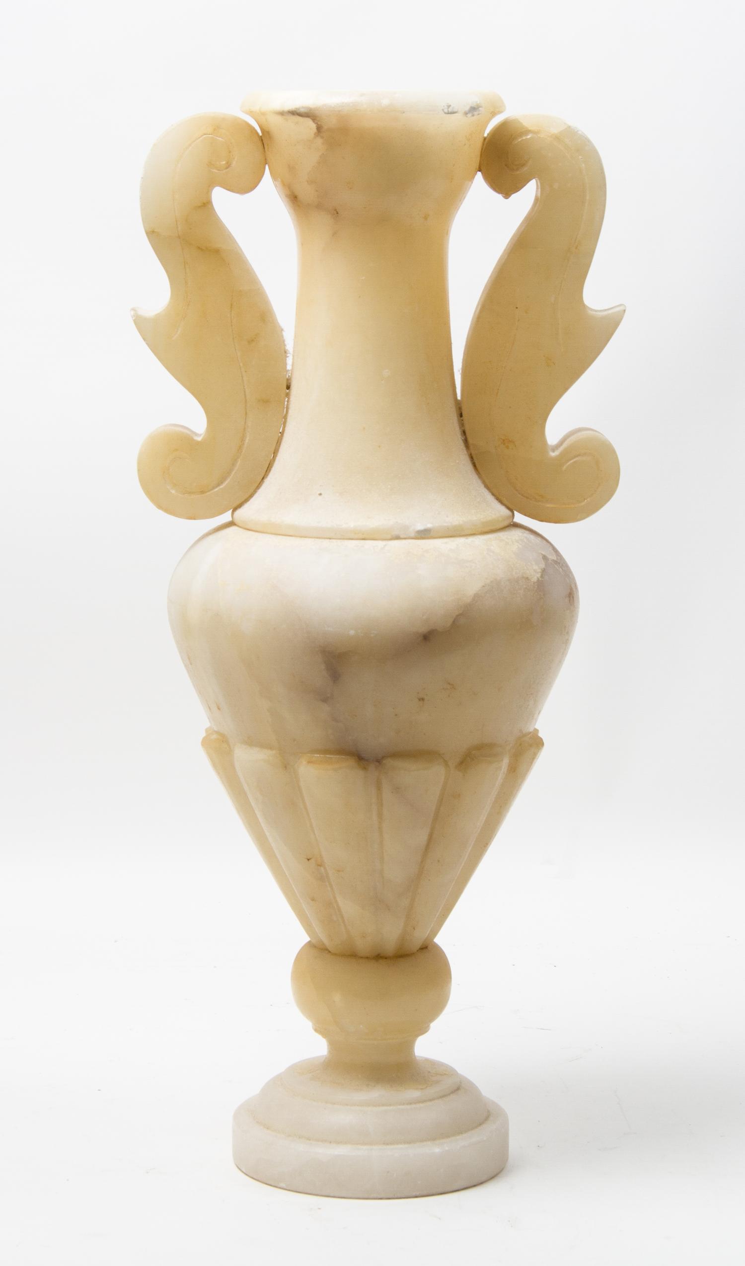 A Carved Stone Urn Height 22 1/2 inches.