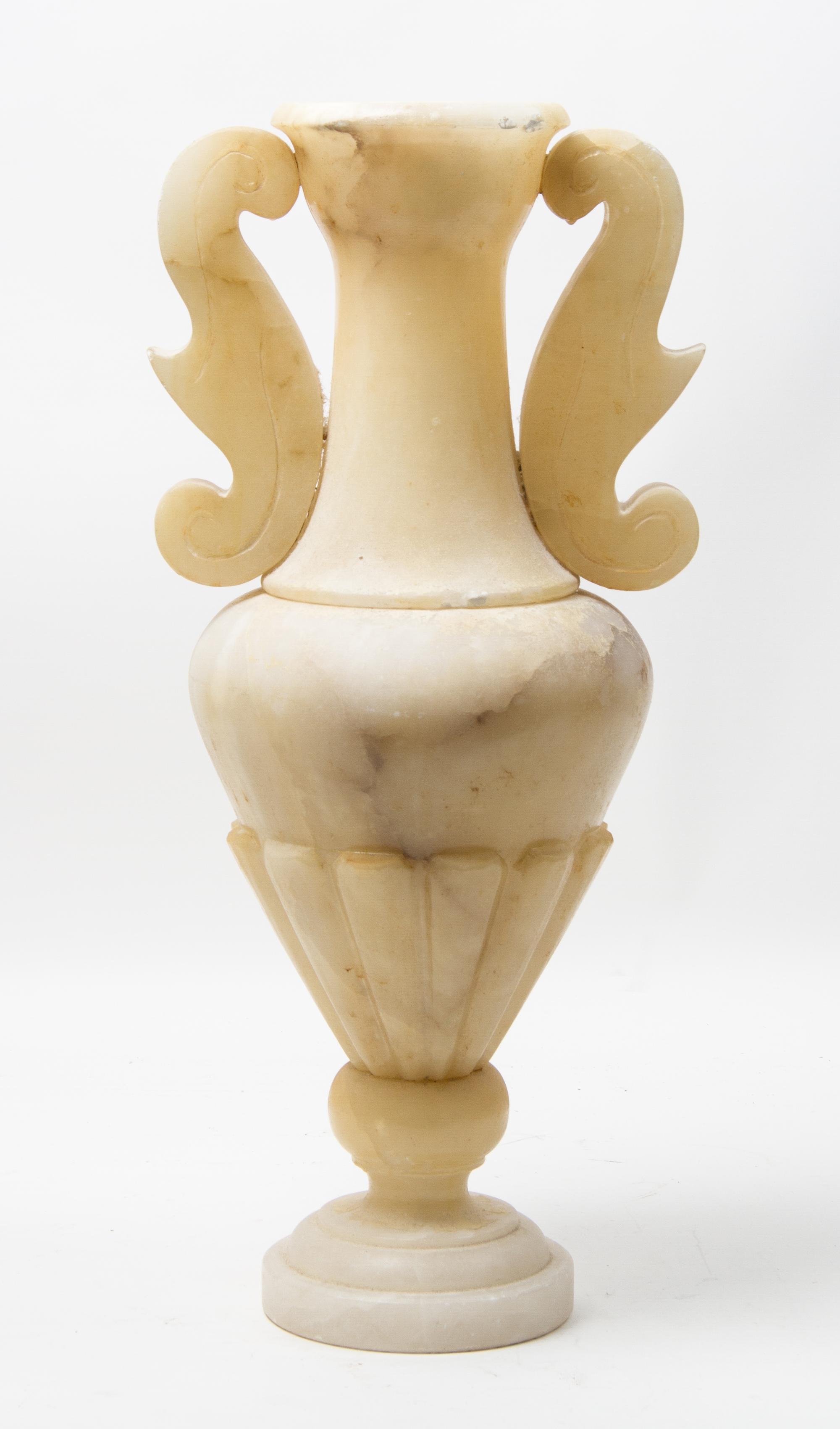 A Carved Stone Urn Height 22 1/2 inches.