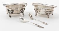 A Pair of American Silver Castors, Gorham Mfg. Co., Providence, RI, of ovoid form with scalloped rim and raised on four feet