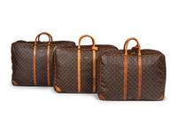 A Group of Three Louis Vuitton Soft-Sided Suitcases, 20th Century