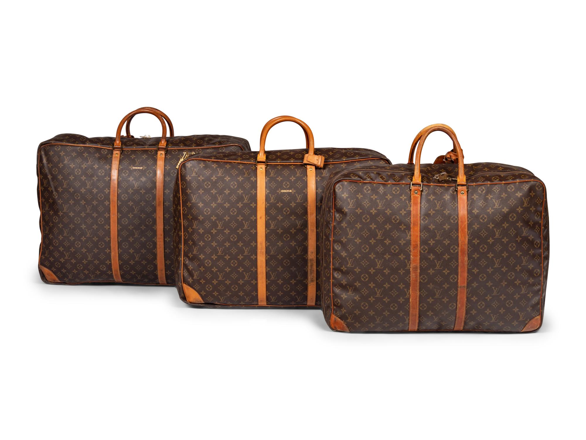 A Group of Three Louis Vuitton Soft-Sided Suitcases, 20th Century