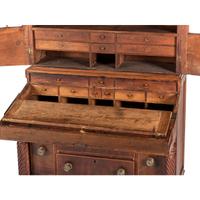A Classical Figured Maple and Mahogany Desk-and-Bookcase