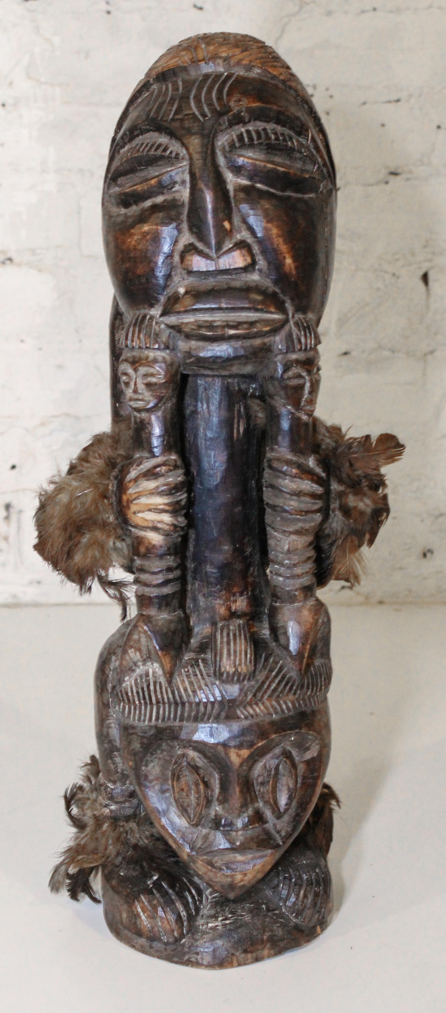 An African Carved Wood Figure. Height of 21 1/2 inches.
